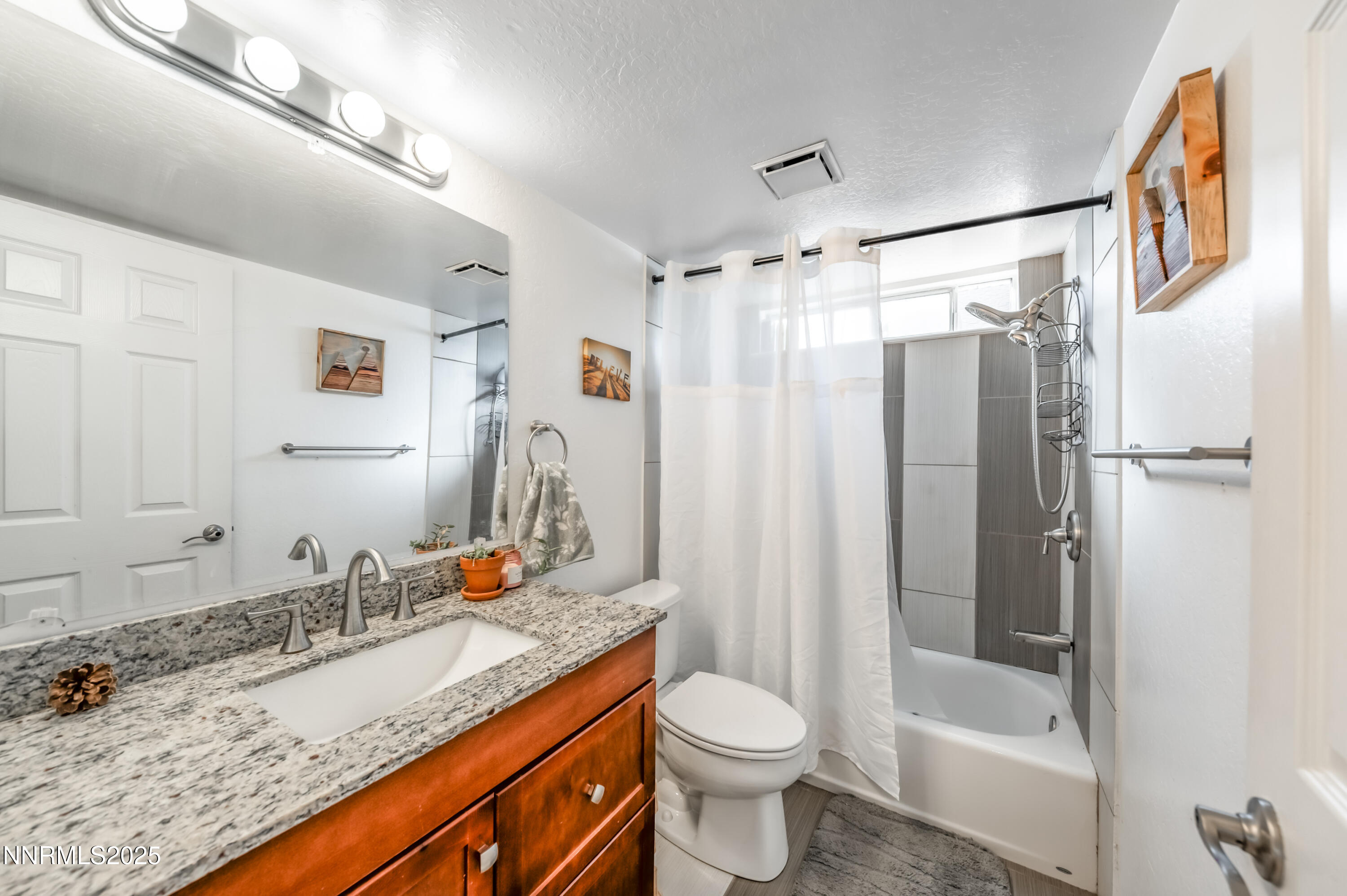 1185 Westlake Road Reno, NV 89523 - Photo 8 of 26 a bathroom with a granite countertop sink toilet and shower