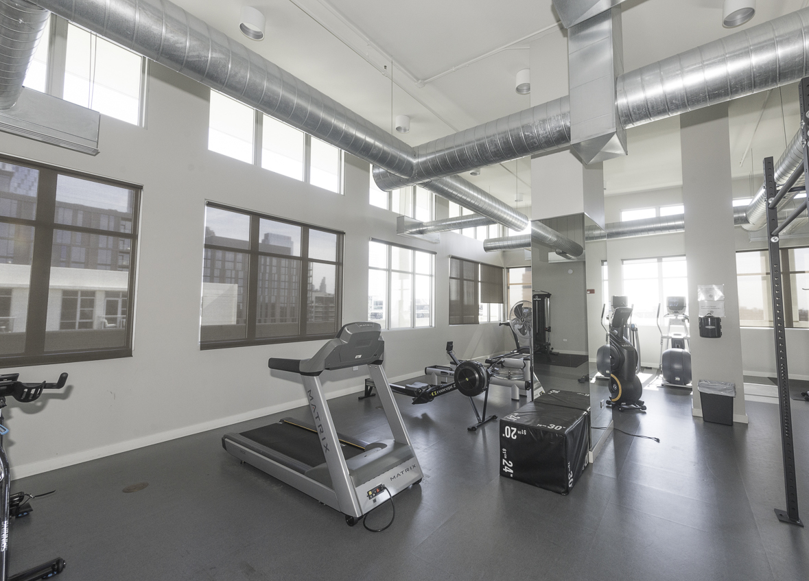 901 West Madison Street, Unit 818 Chicago, IL 60607 - Photo 26 of 26 a room with gym equipment