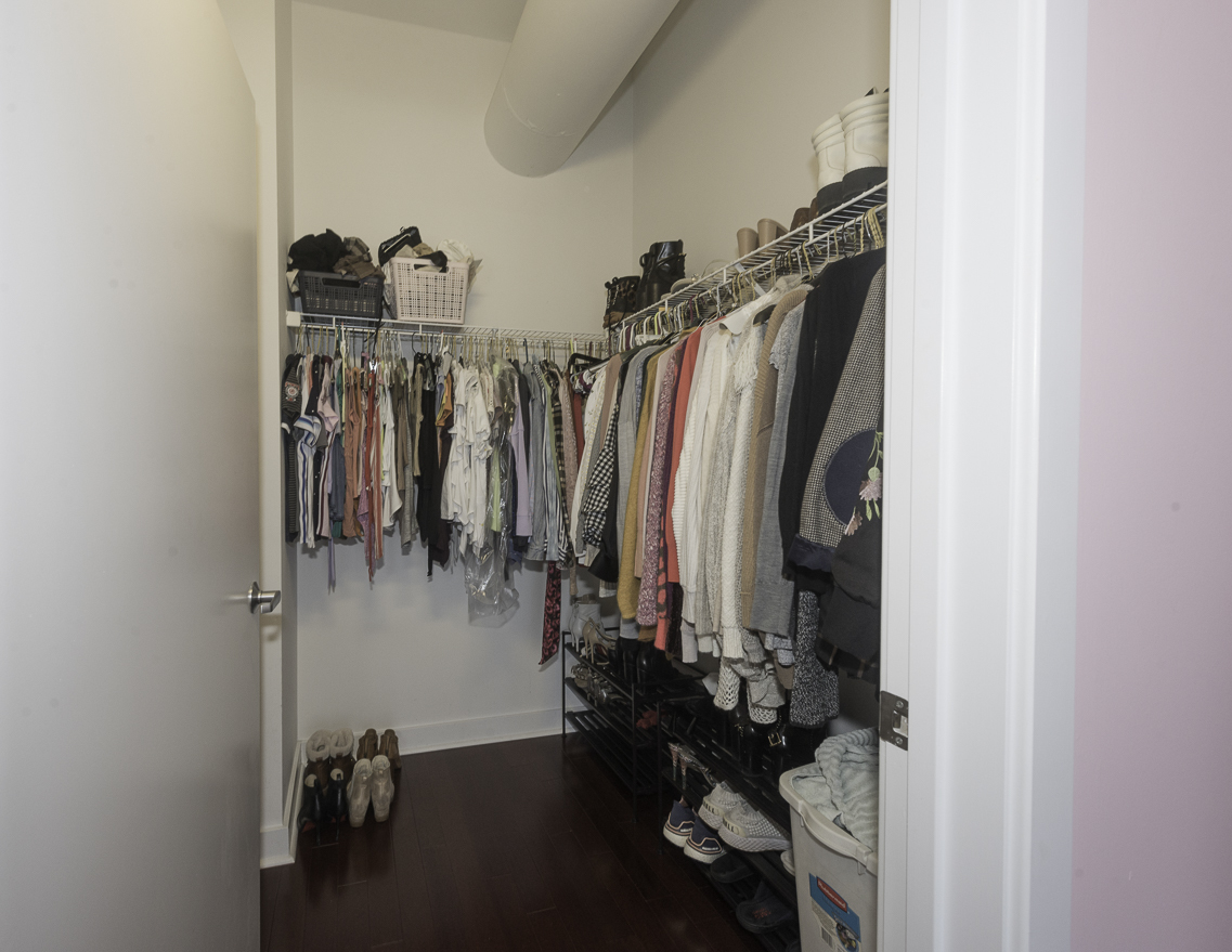 901 West Madison Street, Unit 818 Chicago, IL 60607 - Photo 9 of 26 a view of walk in closet with clothes