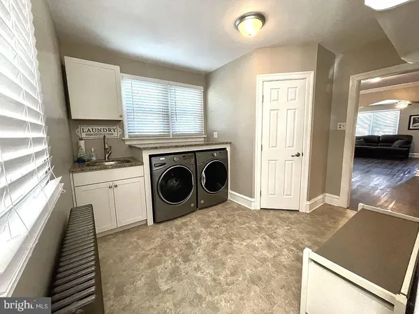 a view of a kitchen with washer and dryer