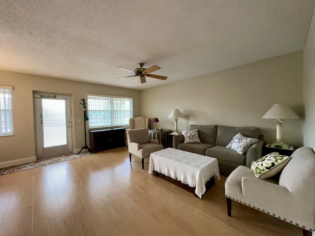 a bedroom with furniture and wooden floor