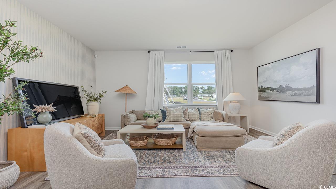 886 Farmers Passage Loop Loris, SC 29569 - Photo 10 of 24 Living room featuring baseboards, visible vents, a