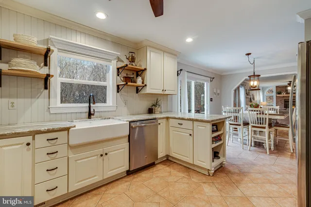 a kitchen with granite countertop stainless steel appliances and counter space