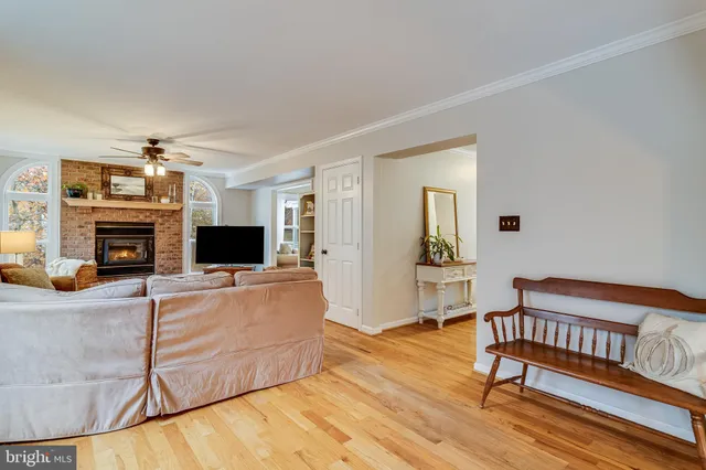 a living room with furniture flat screen tv and a fireplace