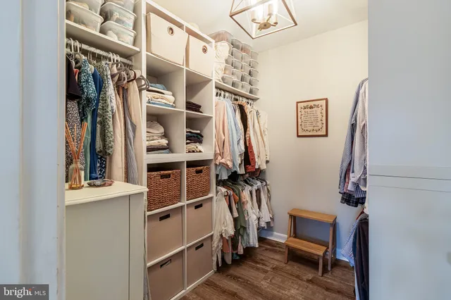 a view of workspace with wooden floor windows gym equipment and view