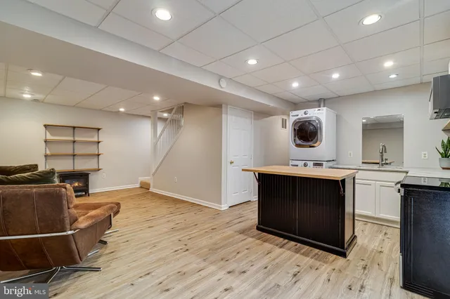 a view of a balcony with chairs and wooden floor
