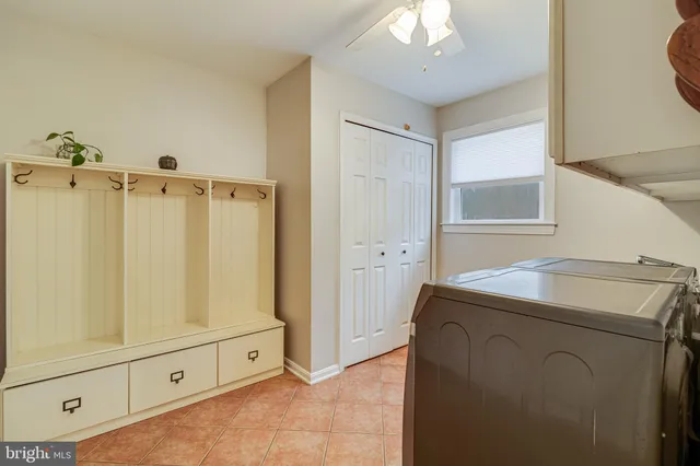 a utility room with sink dryer and washer