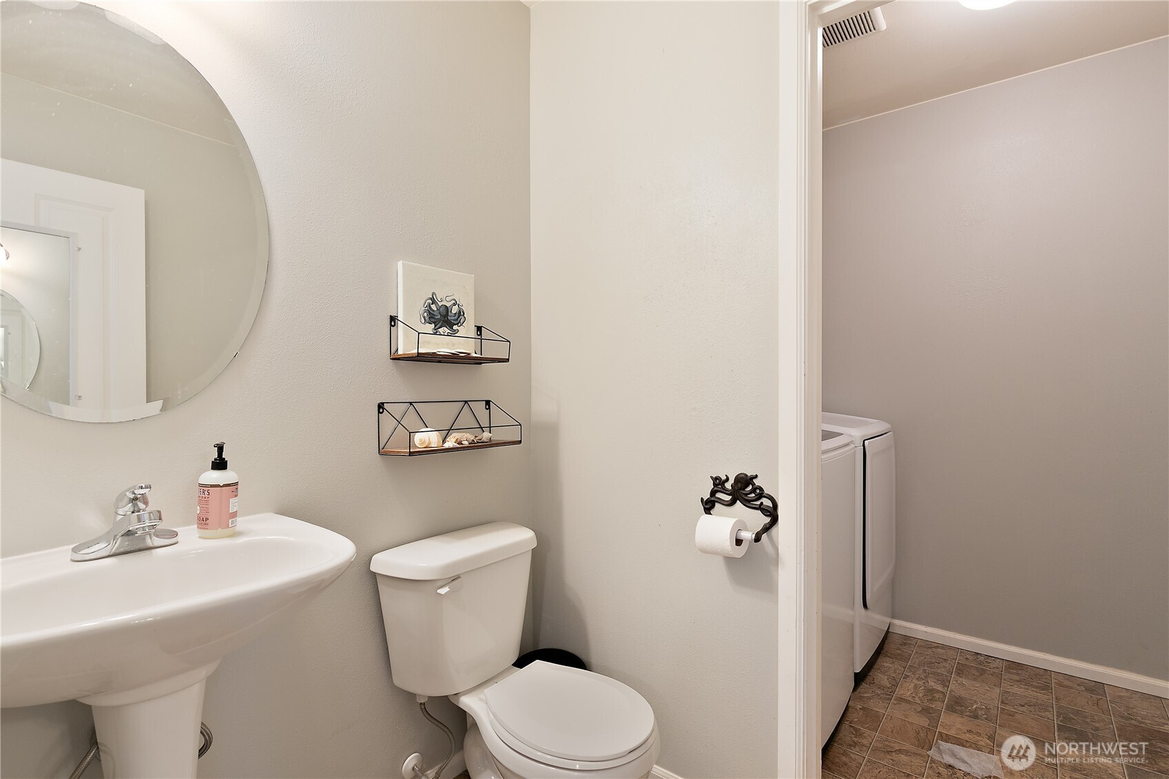 6600 Indiana Street Southeast Lacey, WA 98513 - Photo 10 of 21 a bathroom with a toilet sink and mirror