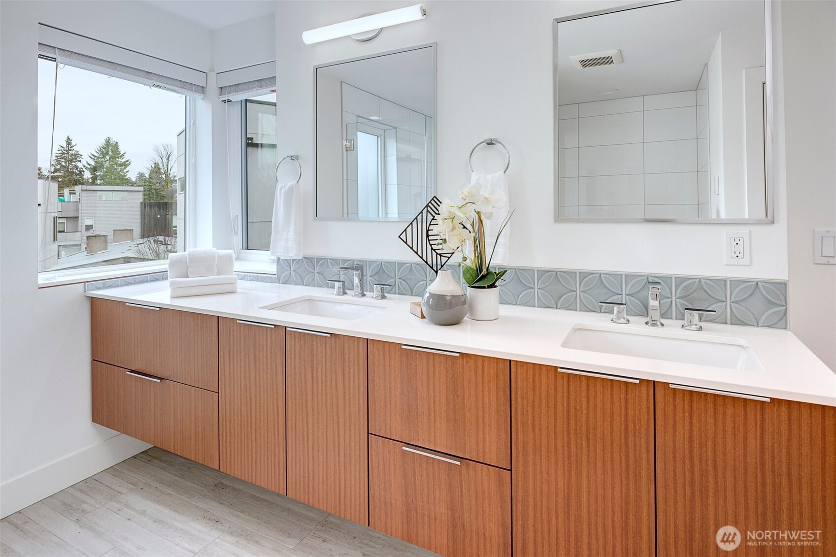4274 Northeast 50th Street Seattle, WA 98105 - Photo 14 of 22 a bathroom with a granite countertop sink and a mirror