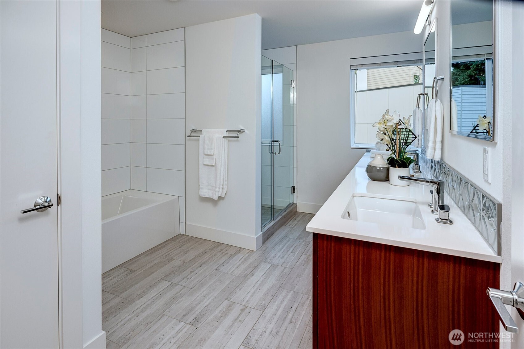 4274 Northeast 50th Street Seattle, WA 98105 - Photo 16 of 22 a bathroom with a sink a shower and a mirror