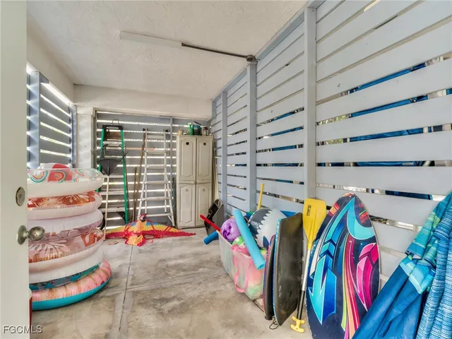 a view of walk in closet with clothes