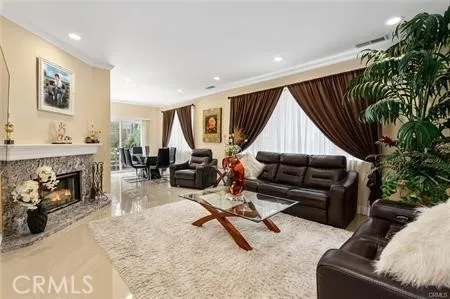 a living room with furniture gym equipment and a fireplace