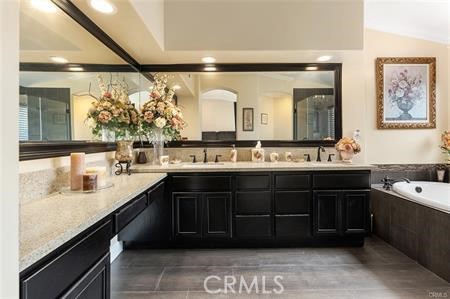 25724 Lewis Way Stevenson Ranch, CA 91381 - Photo 24 of 36 a bathroom with a sink double vanity and a mirror