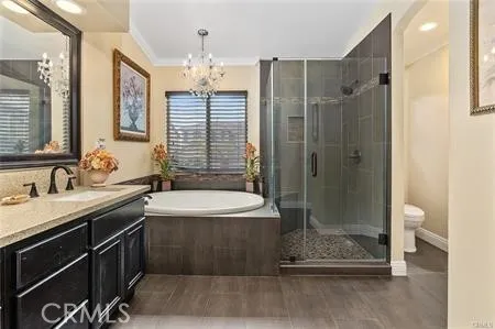 a bathroom with a double vanity sink mirror and shower