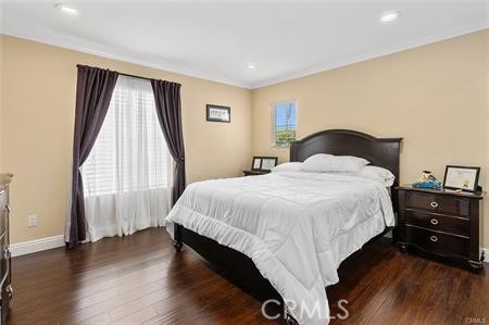25724 Lewis Way Stevenson Ranch, CA 91381 - Photo 26 of 36 a bedroom with a bed and a large window