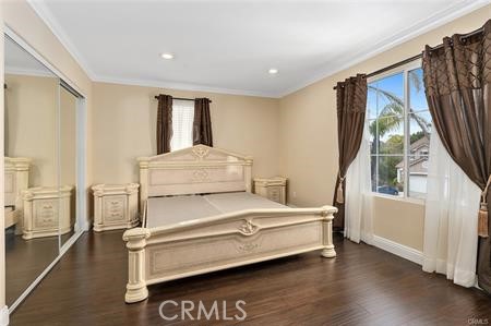 25724 Lewis Way Stevenson Ranch, CA 91381 - Photo 28 of 36 a bedroom with a bed and a large window