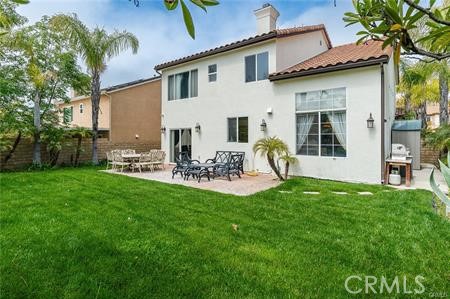 25724 Lewis Way Stevenson Ranch, CA 91381 - Photo 31 of 36 a view of a chair and table in back yard of the house