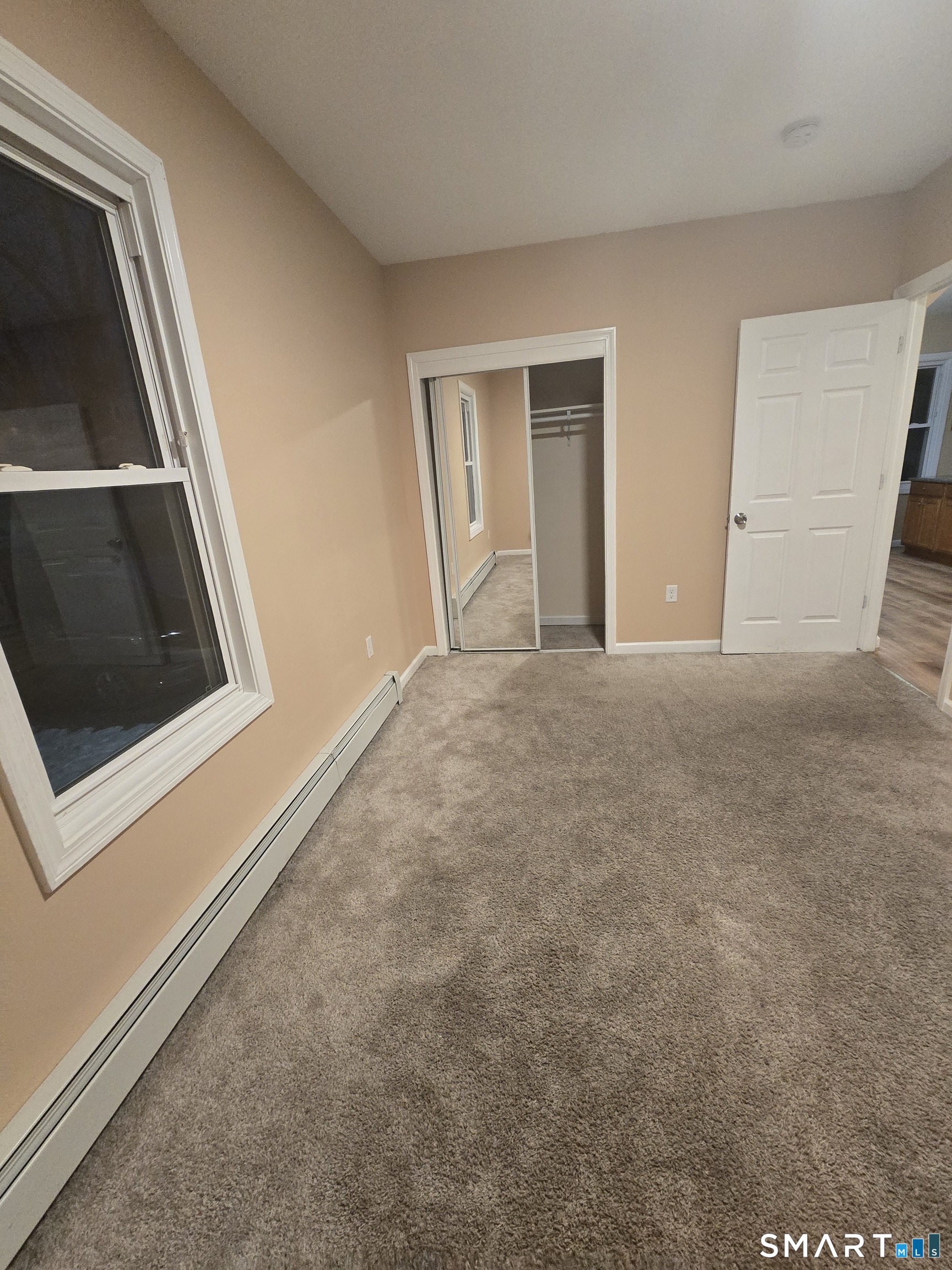 38 Burton Street Hartford, CT 06112 - Photo 13 of 18 a view of empty room with front door