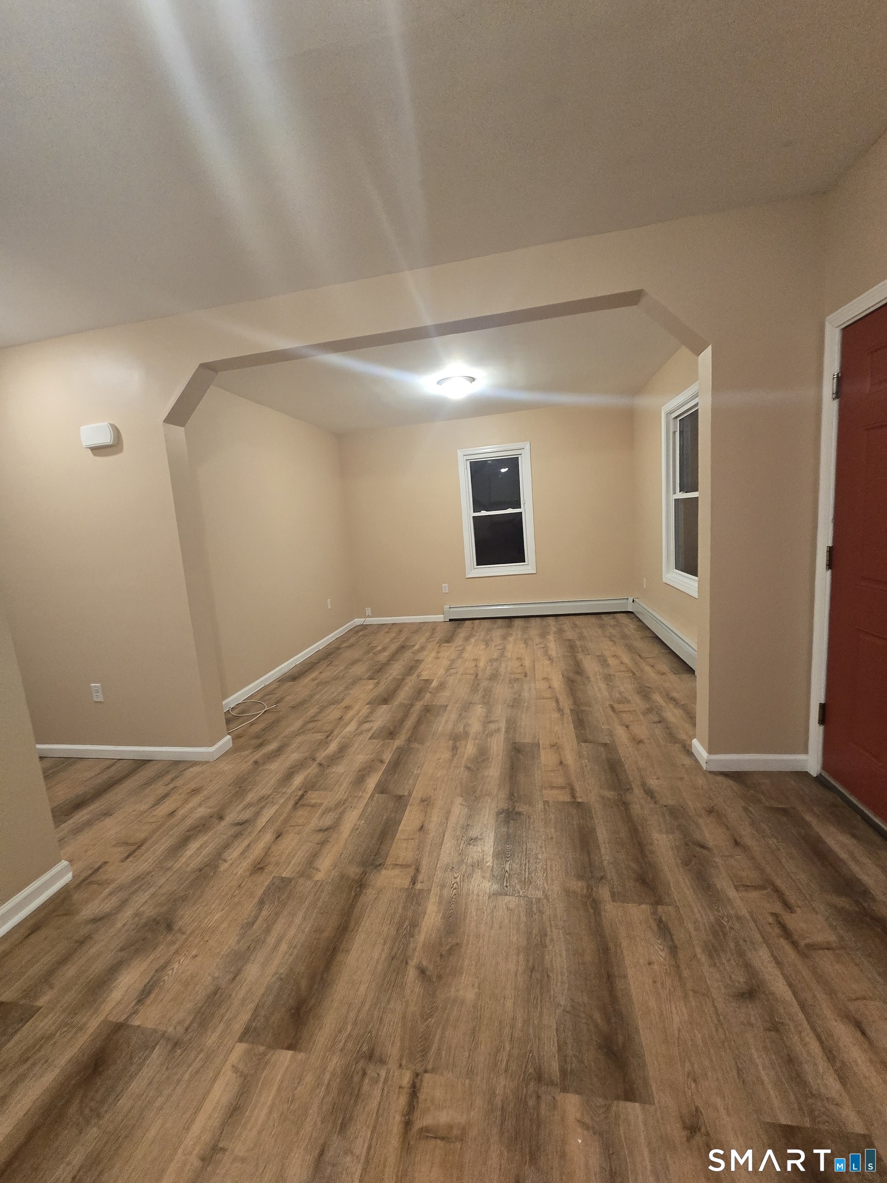 38 Burton Street Hartford, CT 06112 - Photo 2 of 18 a view of empty room with wooden floor