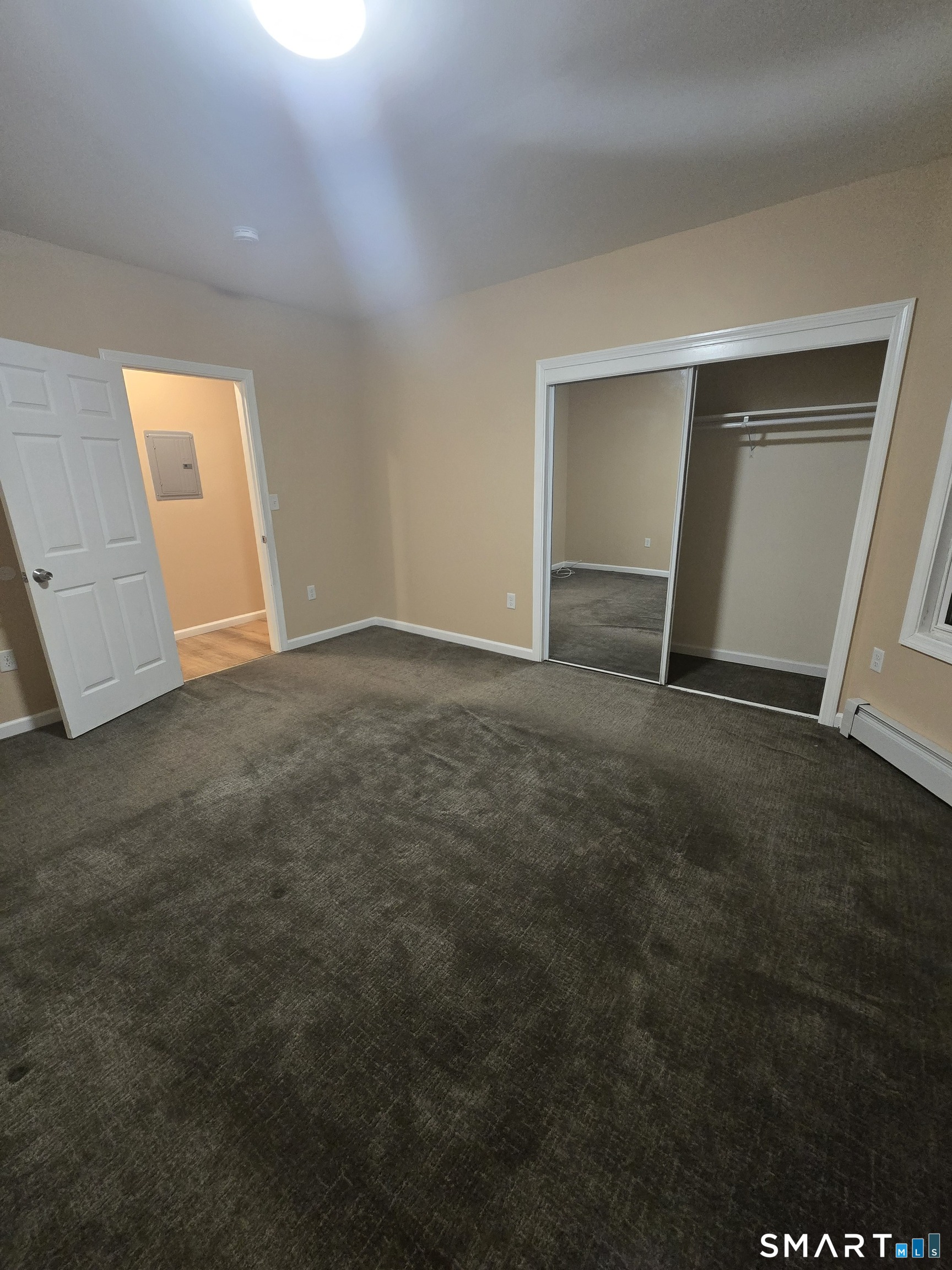 38 Burton Street Hartford, CT 06112 - Photo 6 of 18 an empty room with windows