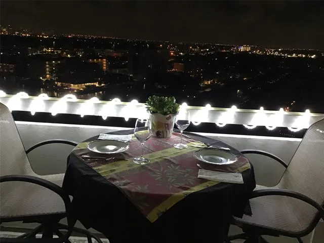 a view of swimming pool with a patio