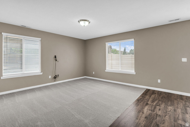 656 South 910 West, Unit 25 Pleasant Grove, UT 84062 - Photo 4 of 25 Spacious room featuring neutral tone walls and a ceiling-mounted light fixture.