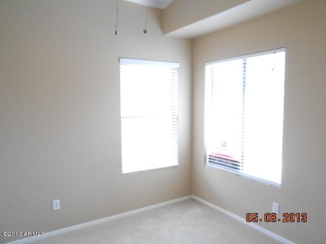 14744 West Calavar Road Surprise, AZ 85379 - Photo 8 of 15 an empty room with a window