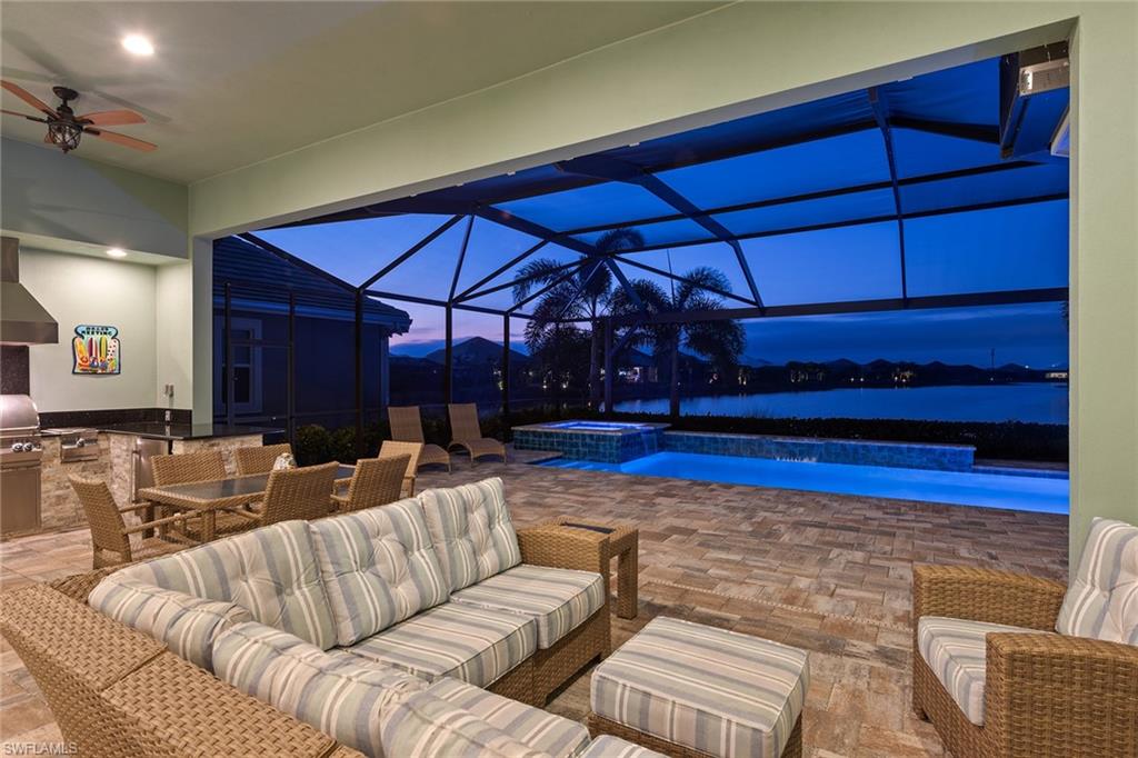 a living room with furniture a lamp and a rug