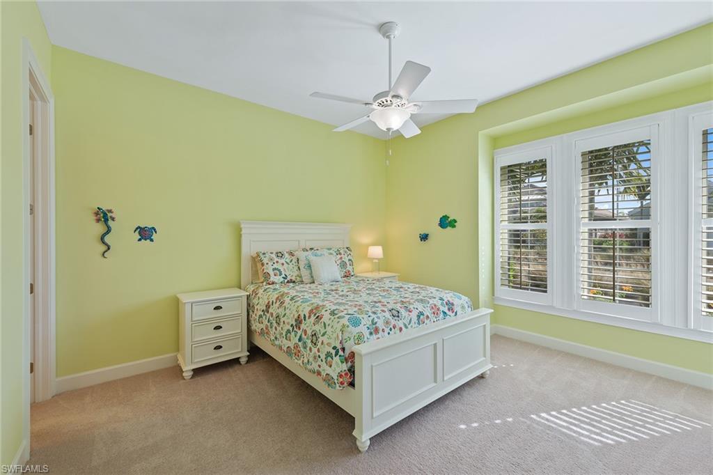 6391 Warwick Avenue Naples, FL 34113 - Photo 12 of 26 a bedroom with a bed and a window