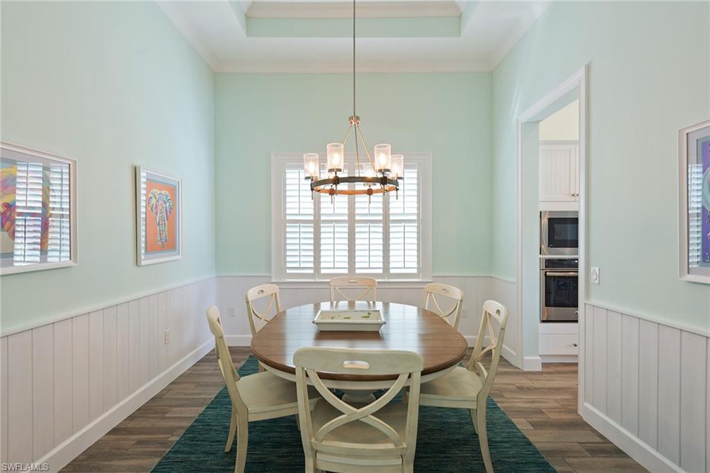 6391 Warwick Avenue Naples, FL 34113 - Photo 15 of 26 a view of a dining room with furniture window and outside view