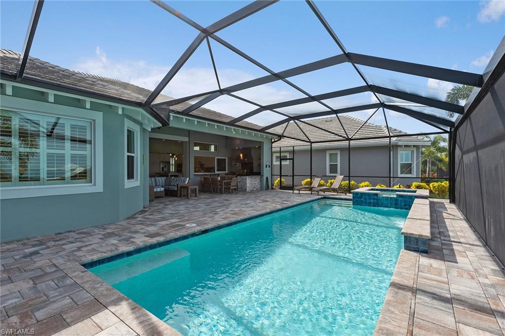 6391 Warwick Avenue Naples, FL 34113 - Photo 17 of 26 a view of a backyard with sitting area