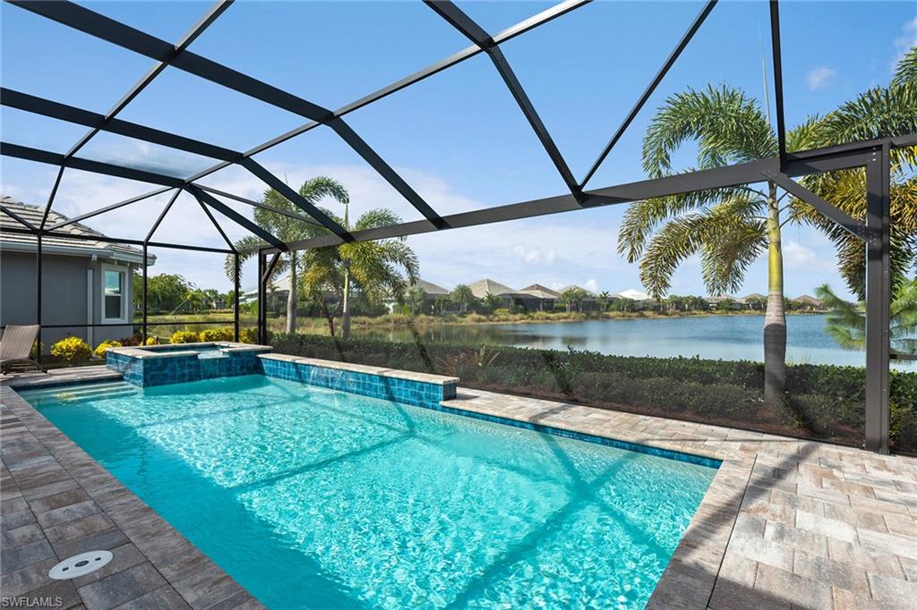 6391 Warwick Avenue Naples, FL 34113 - Photo 18 of 26 a view of a swimming pool with a lake view