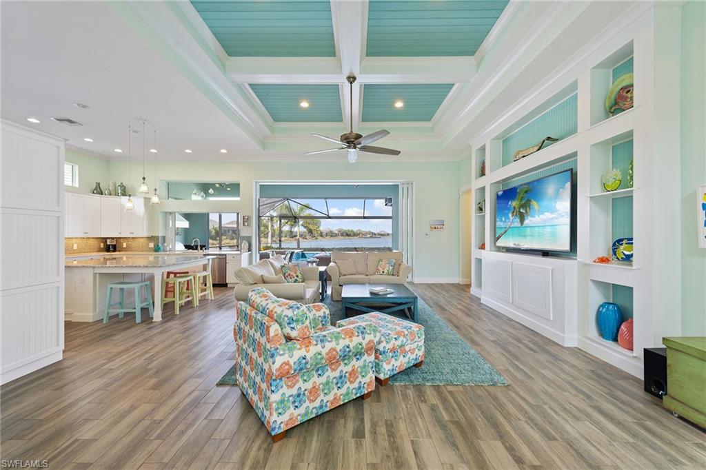 6391 Warwick Avenue Naples, FL 34113 - Photo 4 of 26 a living room with furniture and a table