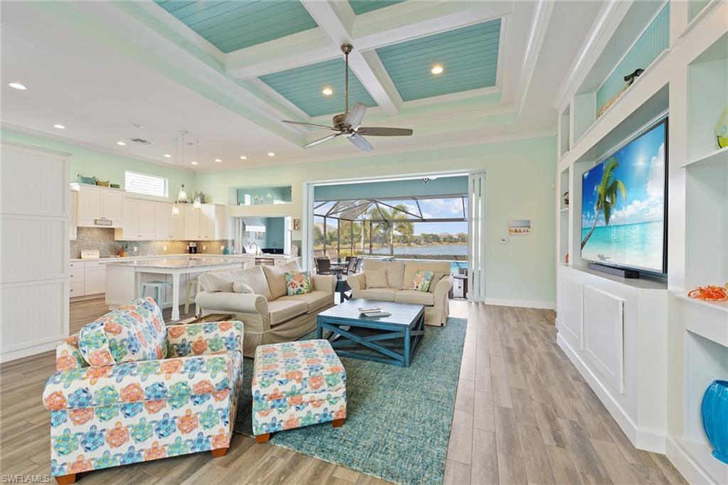 6391 Warwick Avenue Naples, FL 34113 - Photo 5 of 26 a living room with furniture and a flat screen tv