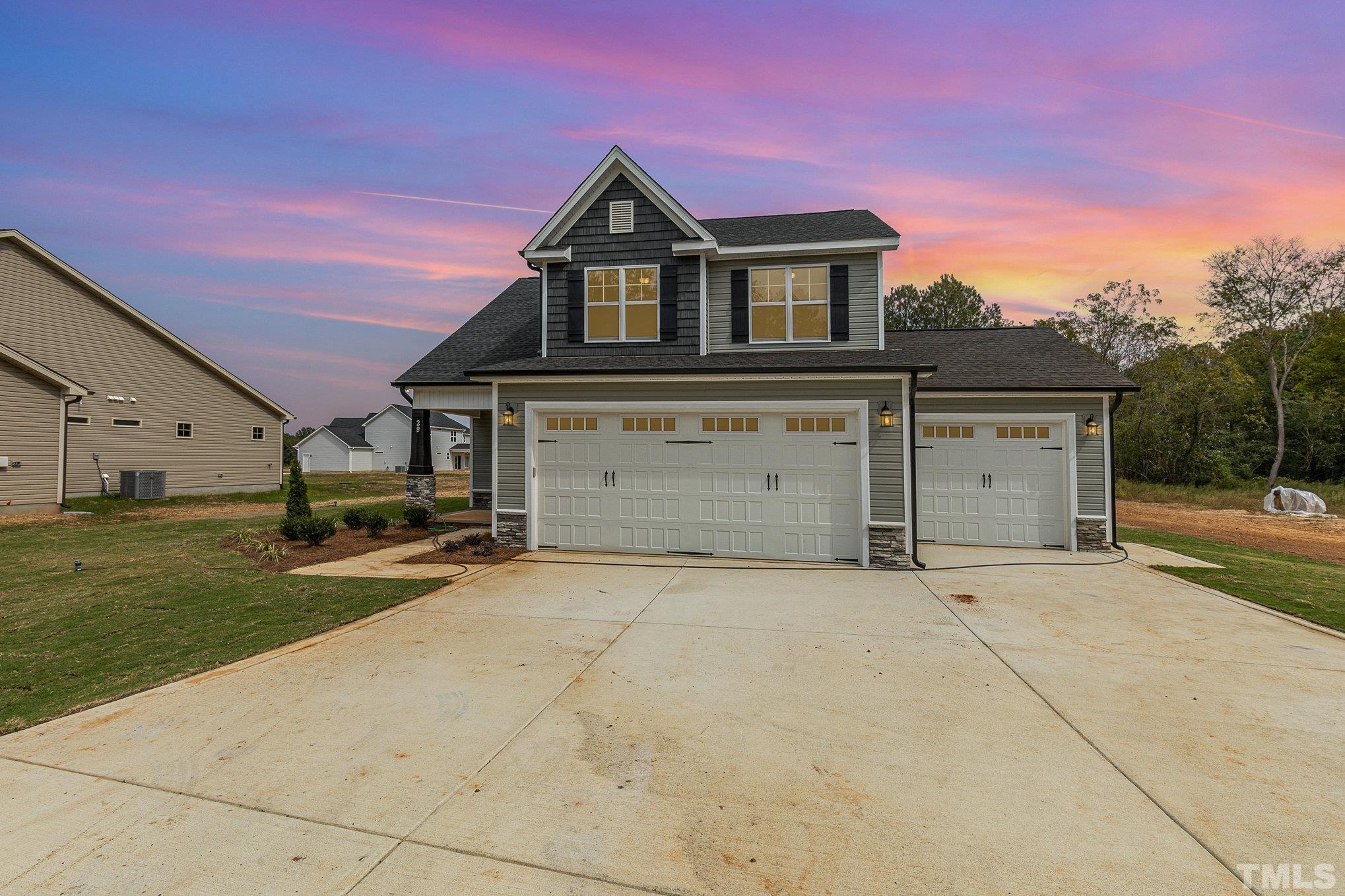 29 Bonnybrook Selma, NC 27576 - Photo 1 of 28 front view of a house with a garage and a yard