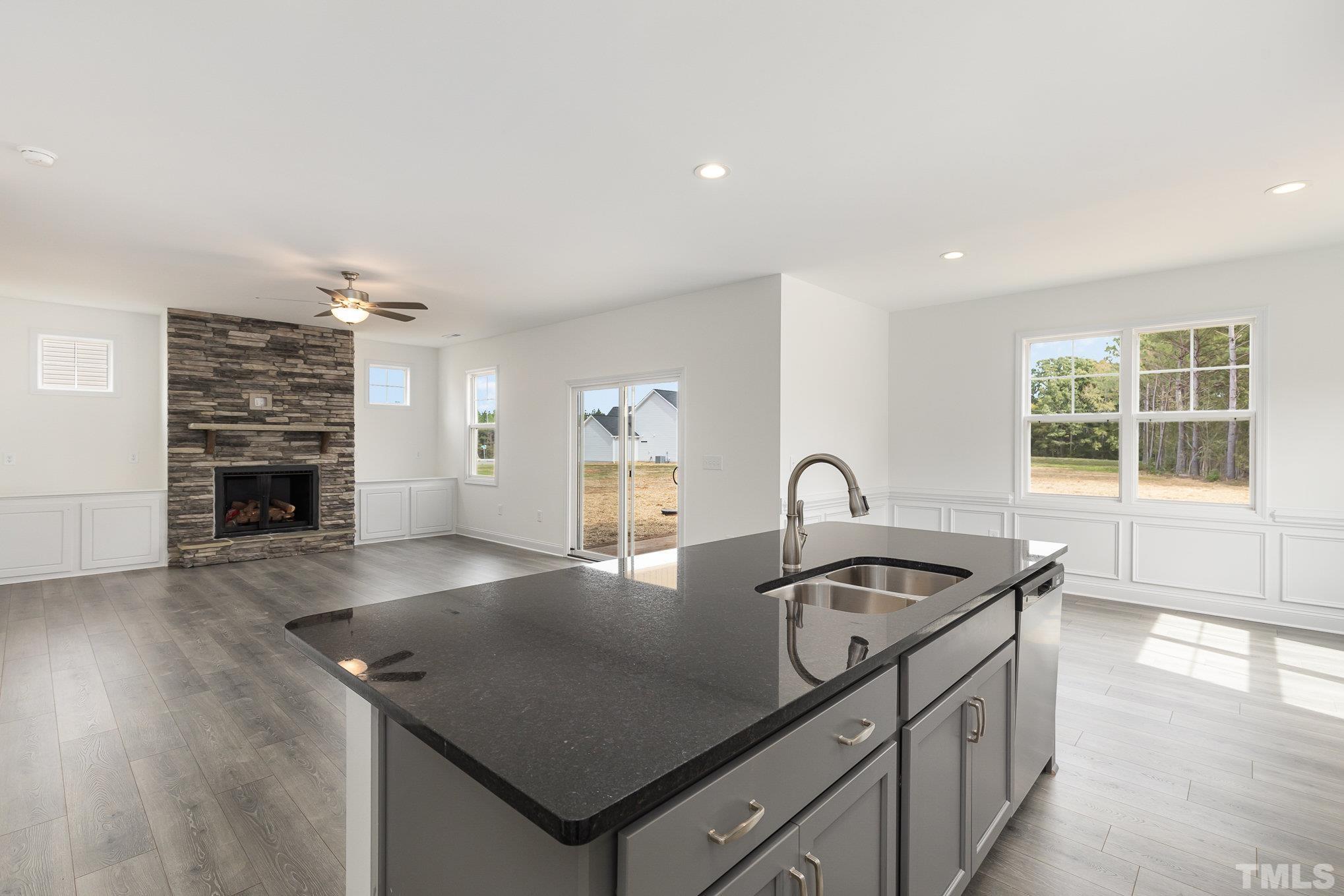 29 Bonnybrook Selma, NC 27576 - Photo 15 of 28 a kitchen with kitchen island a sink appliances and a counter space