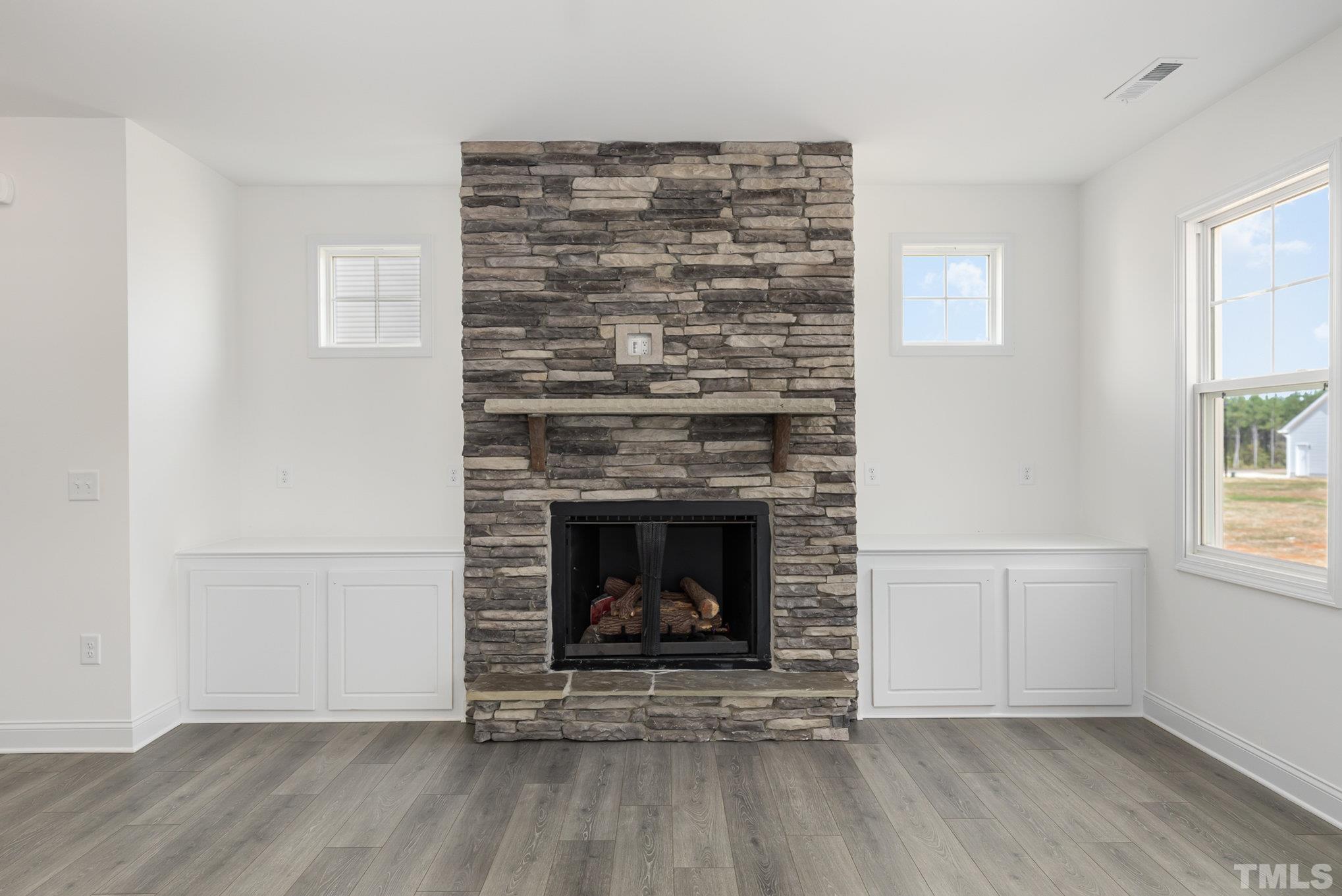 29 Bonnybrook Selma, NC 27576 - Photo 7 of 28 a living room with a fireplace