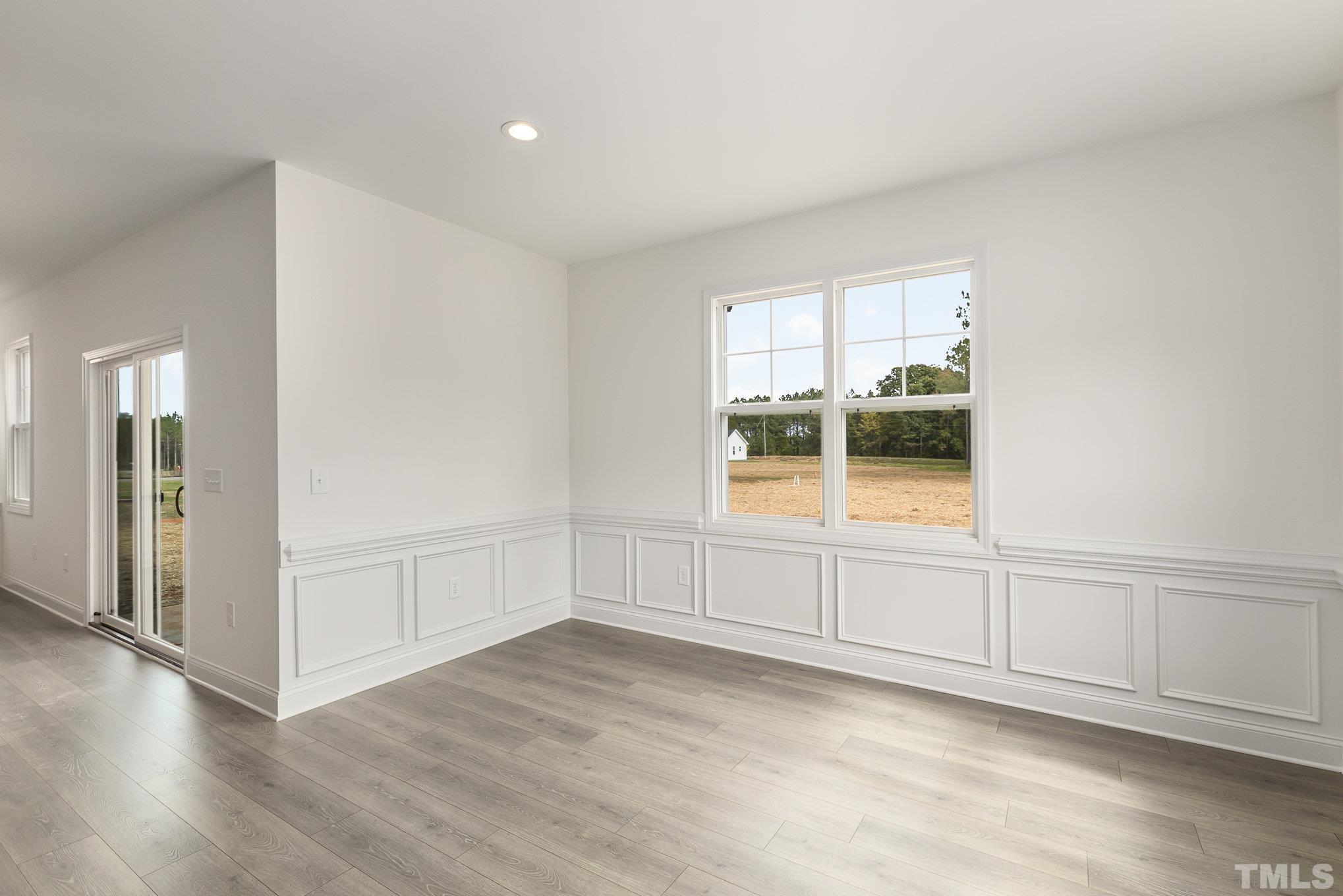 29 Bonnybrook Selma, NC 27576 - Photo 9 of 28 an empty room with wooden floor and windows