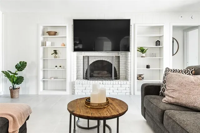 a bedroom with a large bed and a flat screen tv