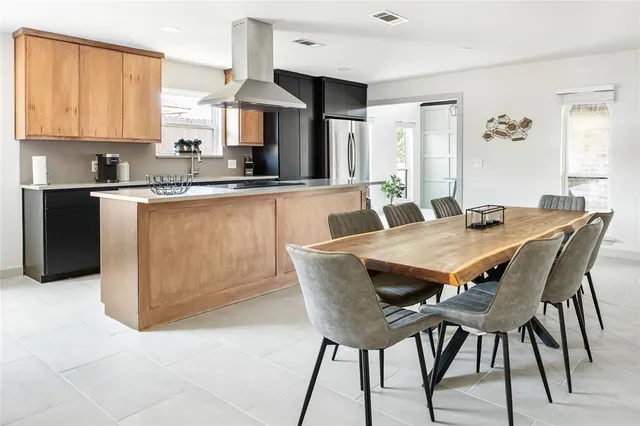 a kitchen with a sink and a refrigerator