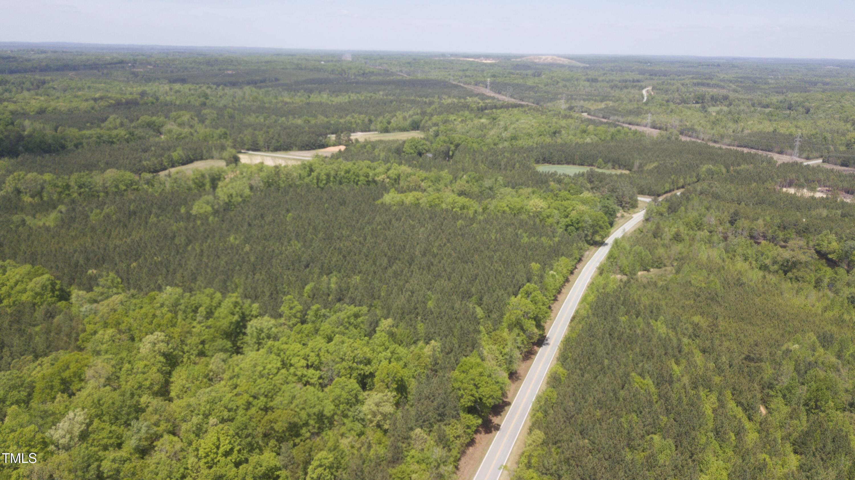 Lot 4 Range Road Rougemont, NC 27572 - Photo 2 of 3 a view of a lake from a yard