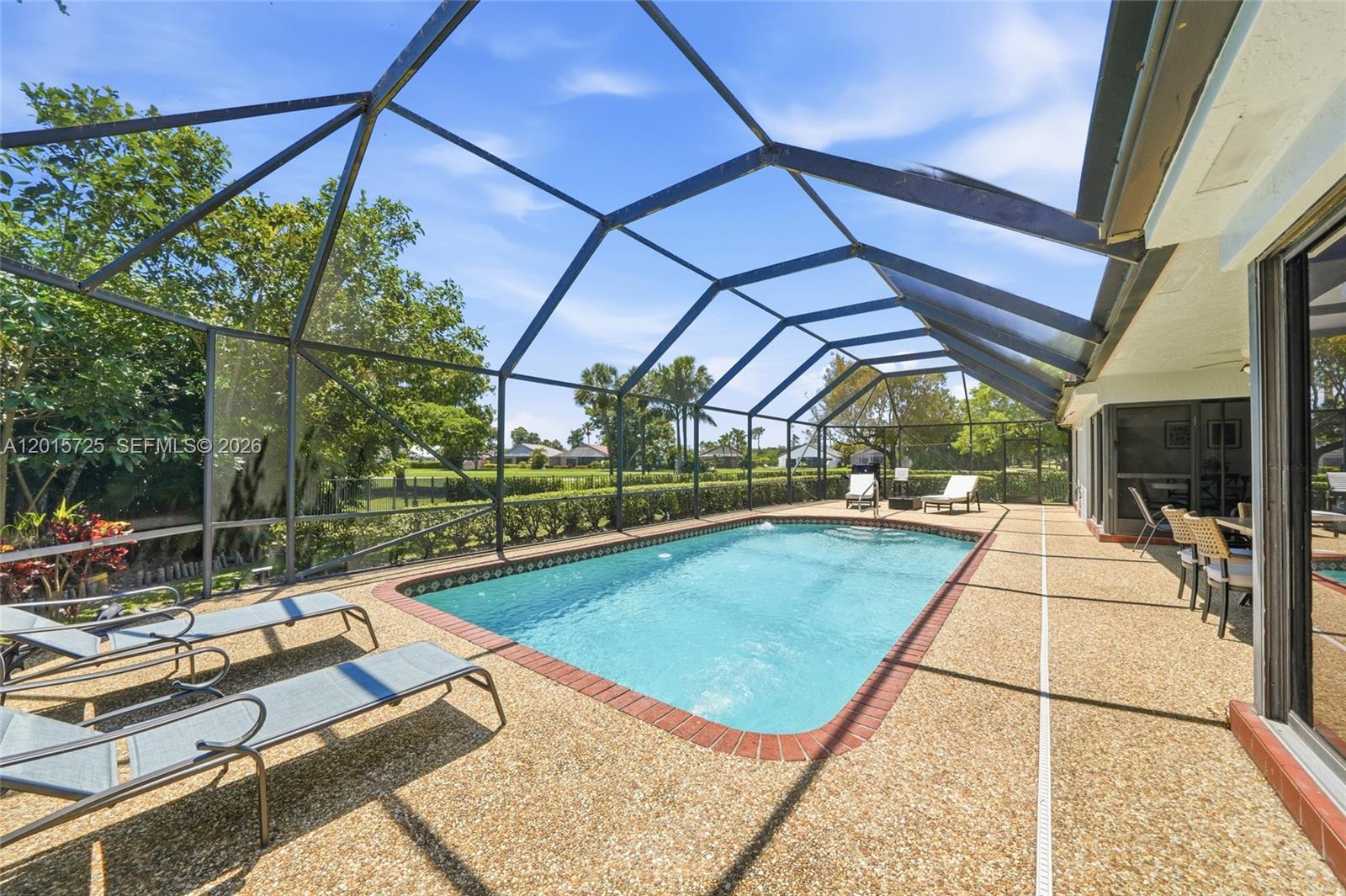 11008 Boca Woods Lane Boca Raton, FL 33428 - Photo 39 of 70 a view of swimming pool with seating area