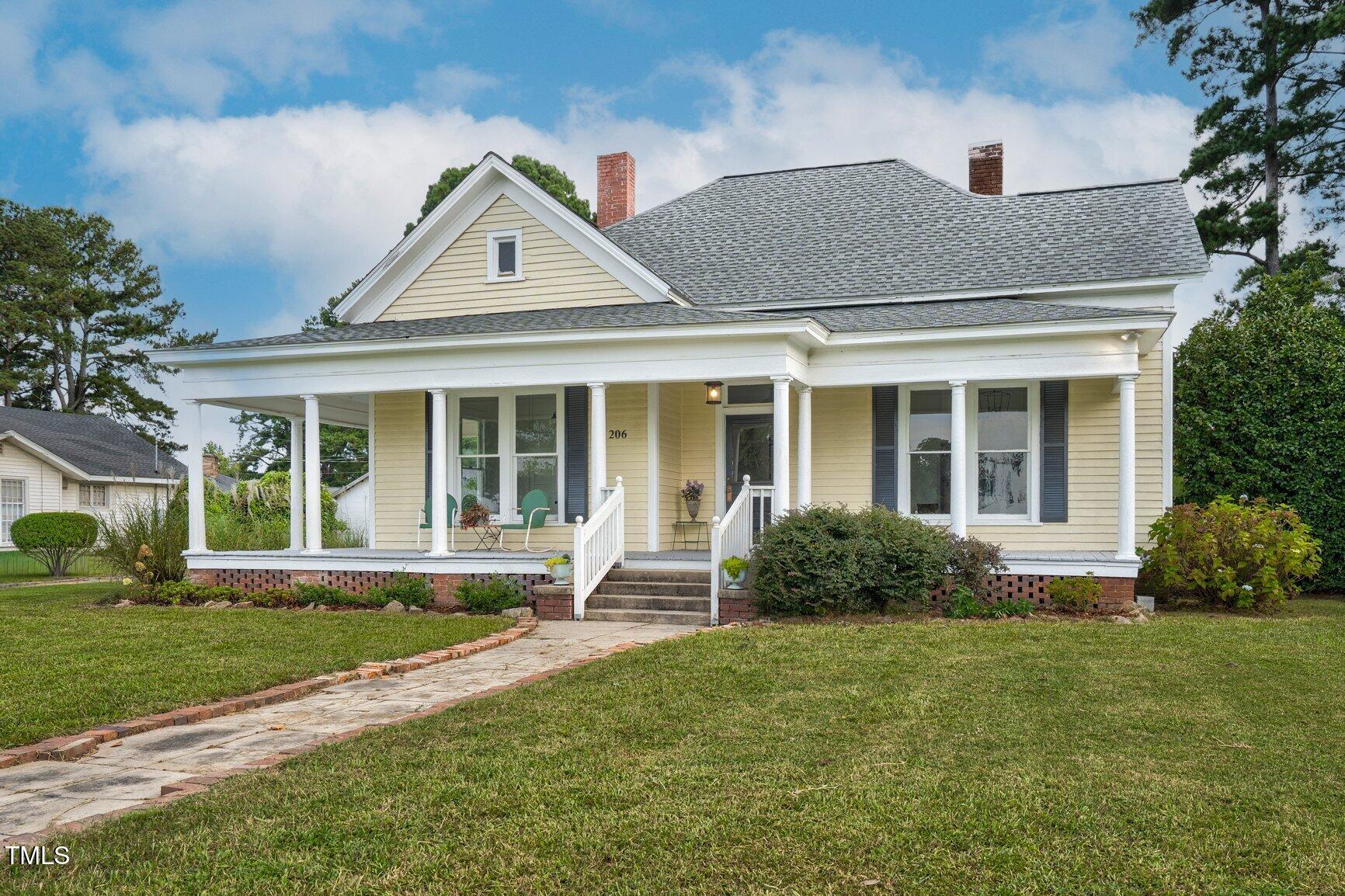 206 West Blalock Road Lucama, NC 27851 - Photo 1 of 35 a house view with a garden space