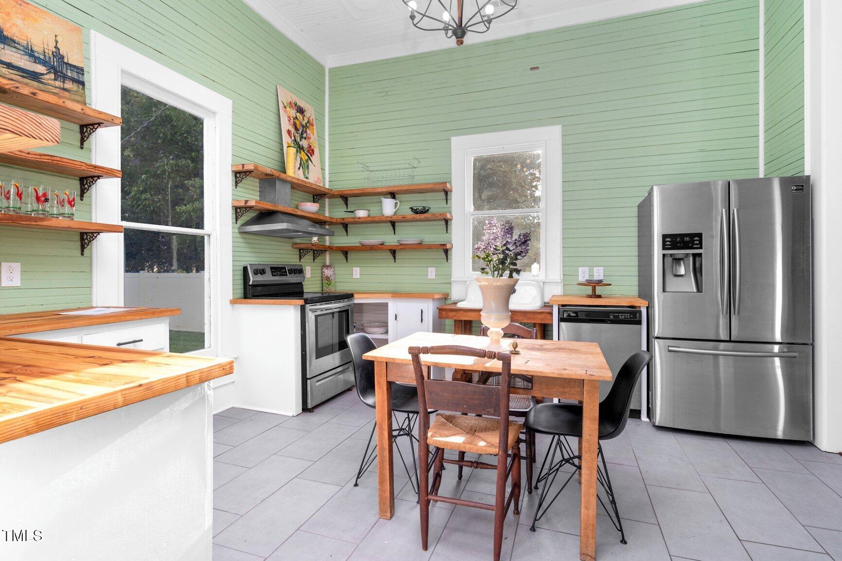 206 West Blalock Road Lucama, NC 27851 - Photo 13 of 35 a outdoor dining space with furniture and a kitchen view