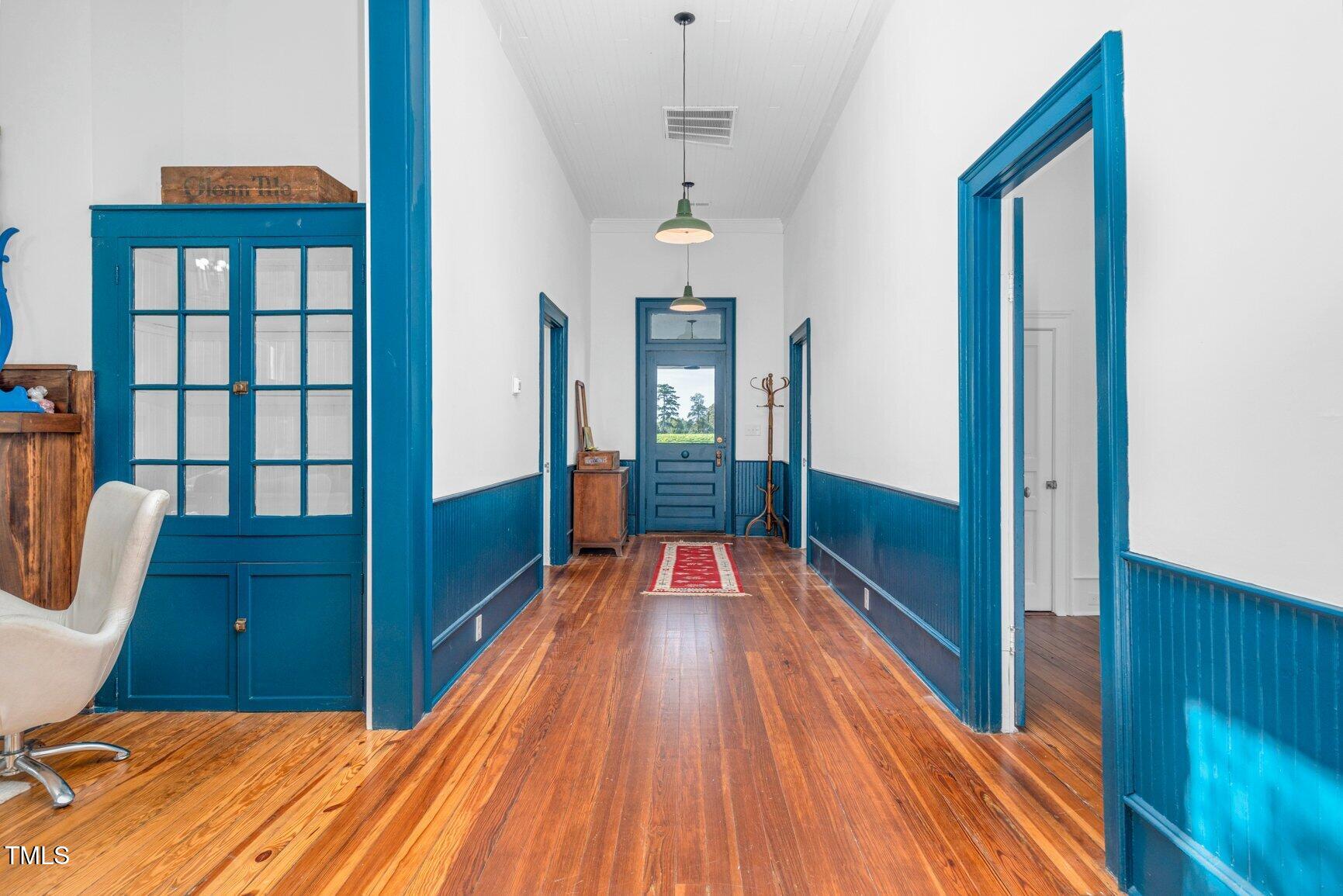 206 West Blalock Road Lucama, NC 27851 - Photo 16 of 35 a view of a hallway with wooden floor and staircase