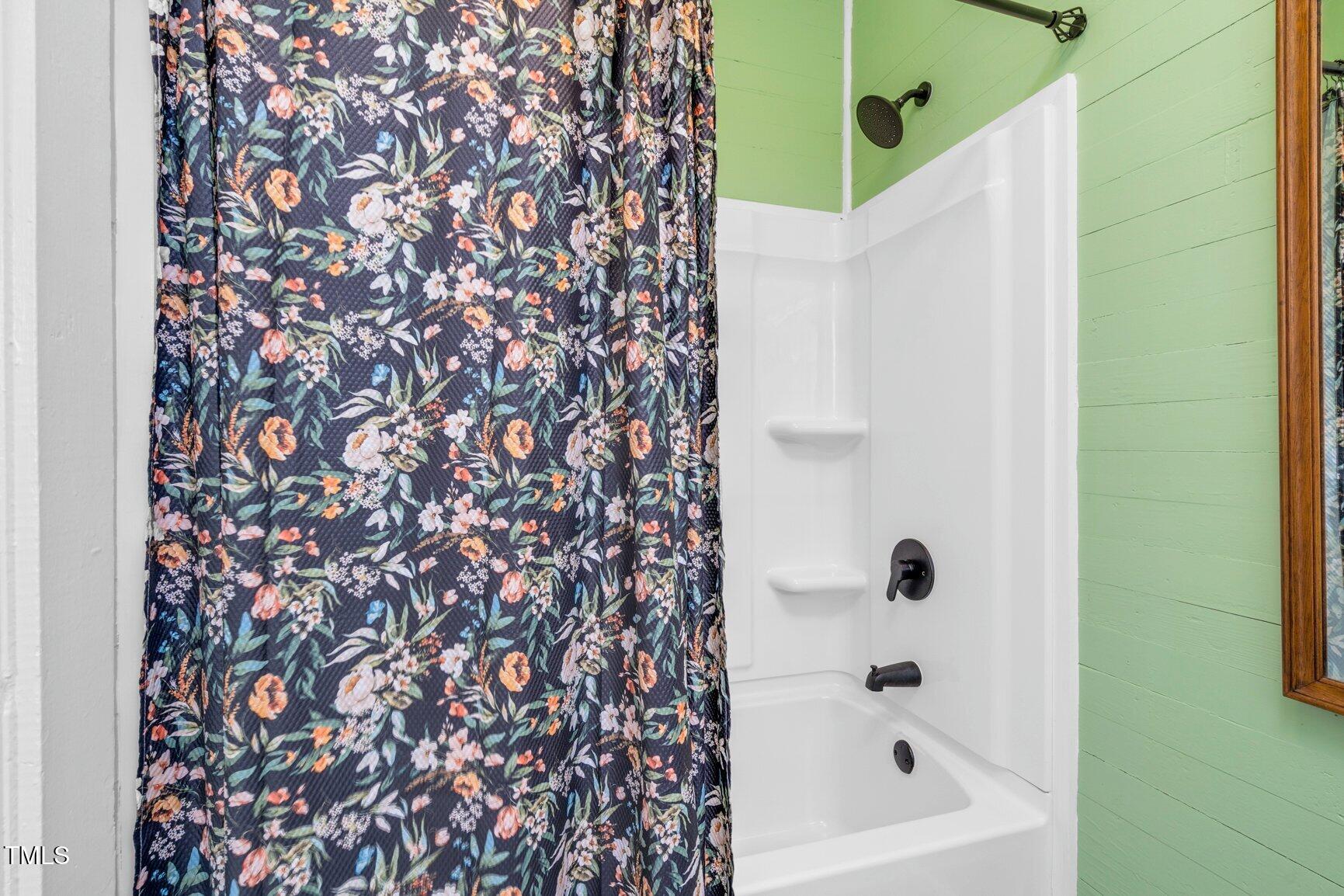 206 West Blalock Road Lucama, NC 27851 - Photo 19 of 35 a bathroom with a bathtub and shower