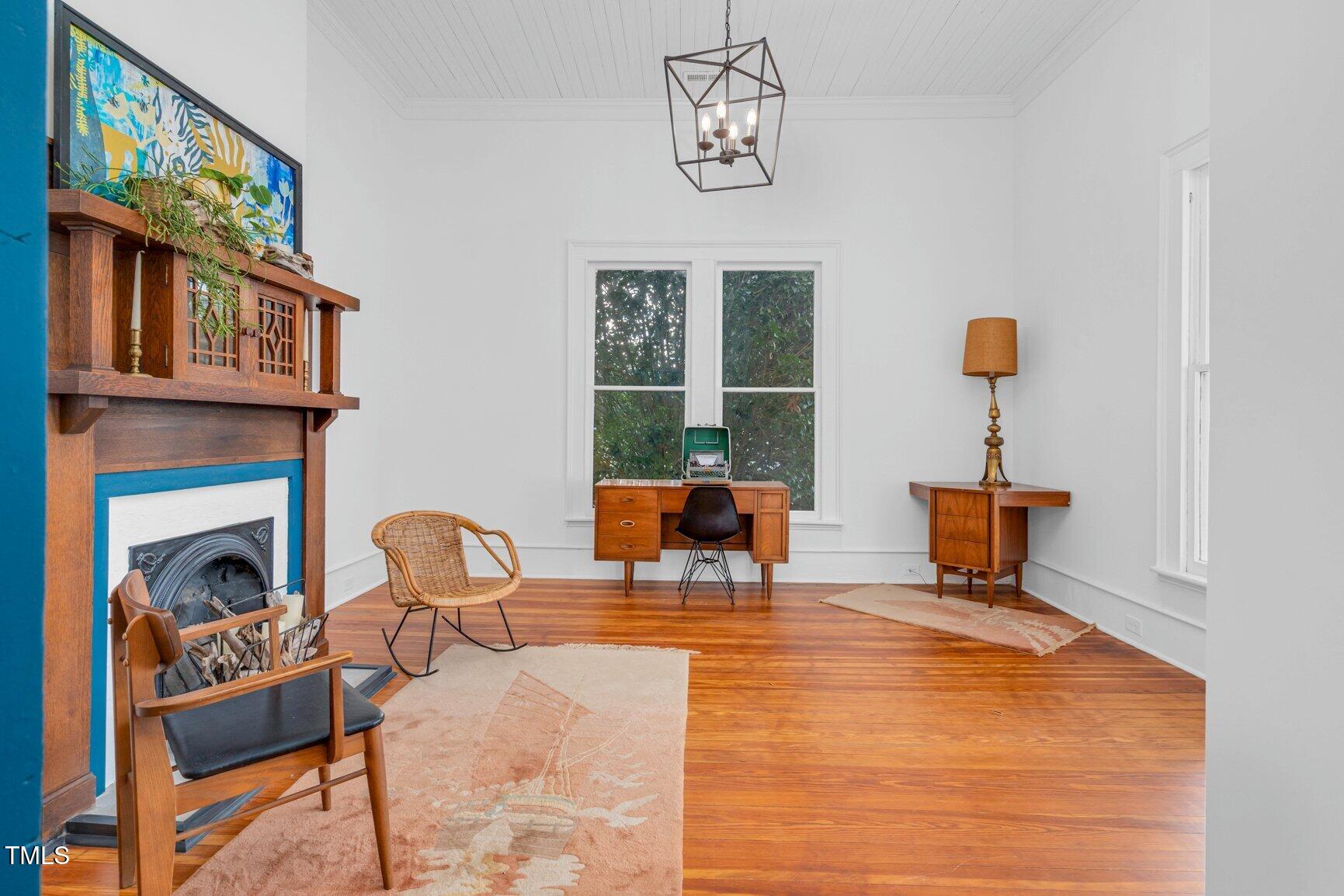 206 West Blalock Road Lucama, NC 27851 - Photo 21 of 35 a living room with furniture a fireplace and dining table