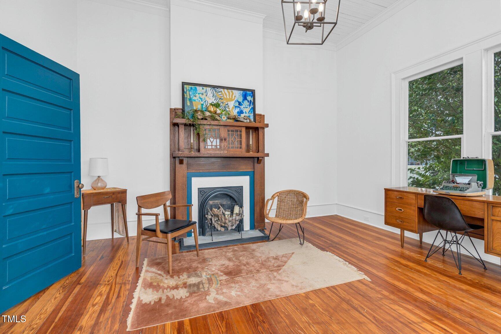 206 West Blalock Road Lucama, NC 27851 - Photo 22 of 35 a living room with furniture and a fireplace