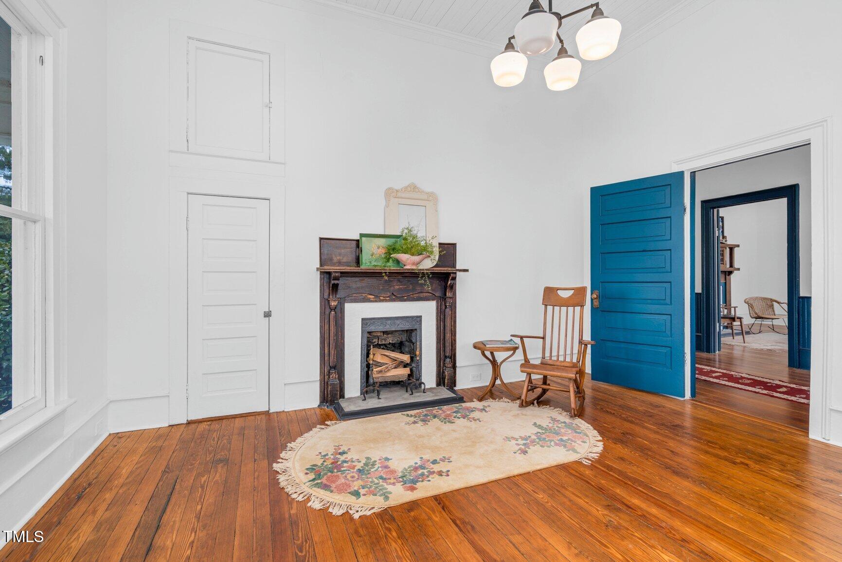 206 West Blalock Road Lucama, NC 27851 - Photo 25 of 35 a bedroom with a bed and a fireplace