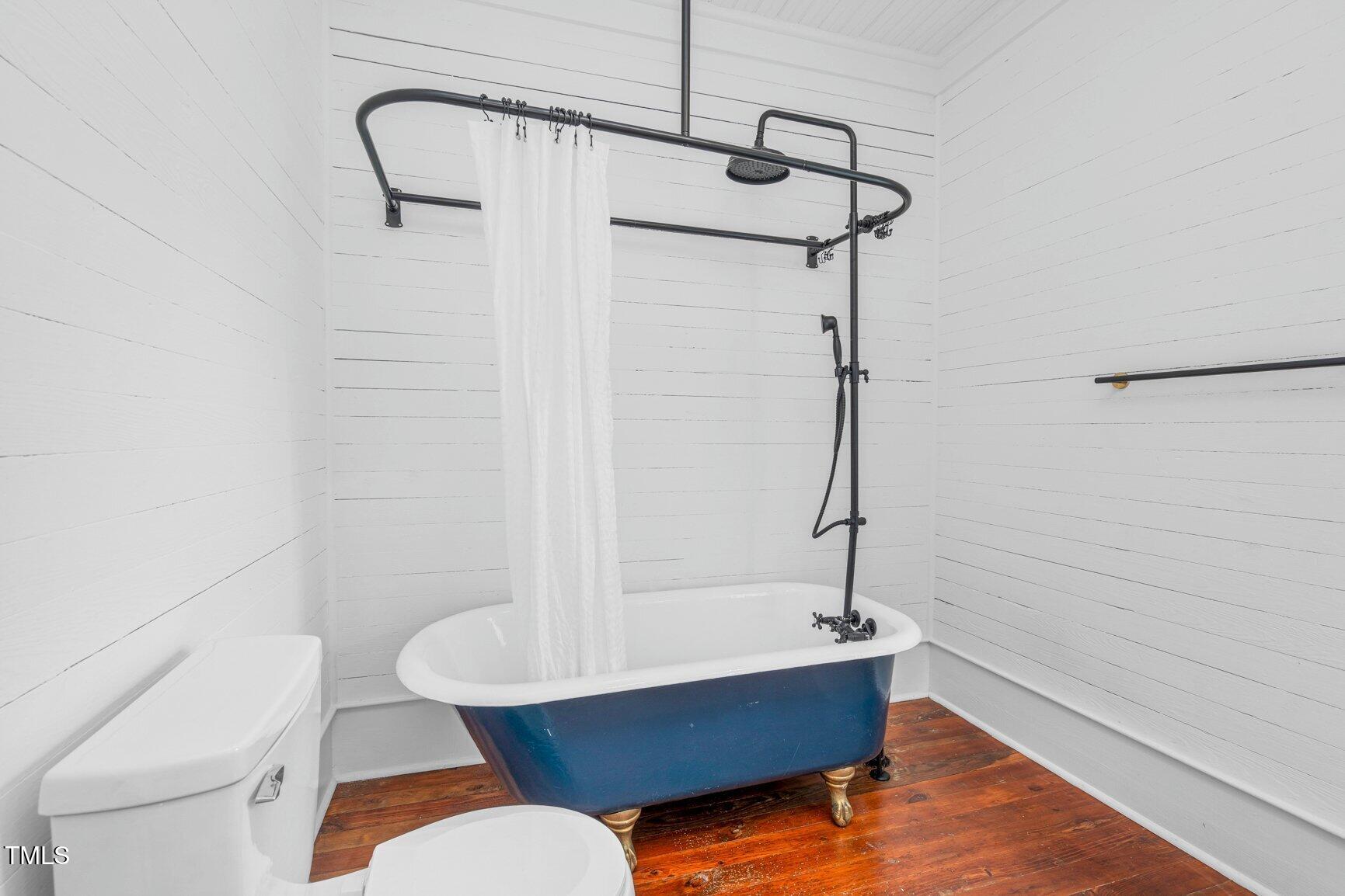 206 West Blalock Road Lucama, NC 27851 - Photo 27 of 35 a bathroom with a sink a toilet a mirror and shower